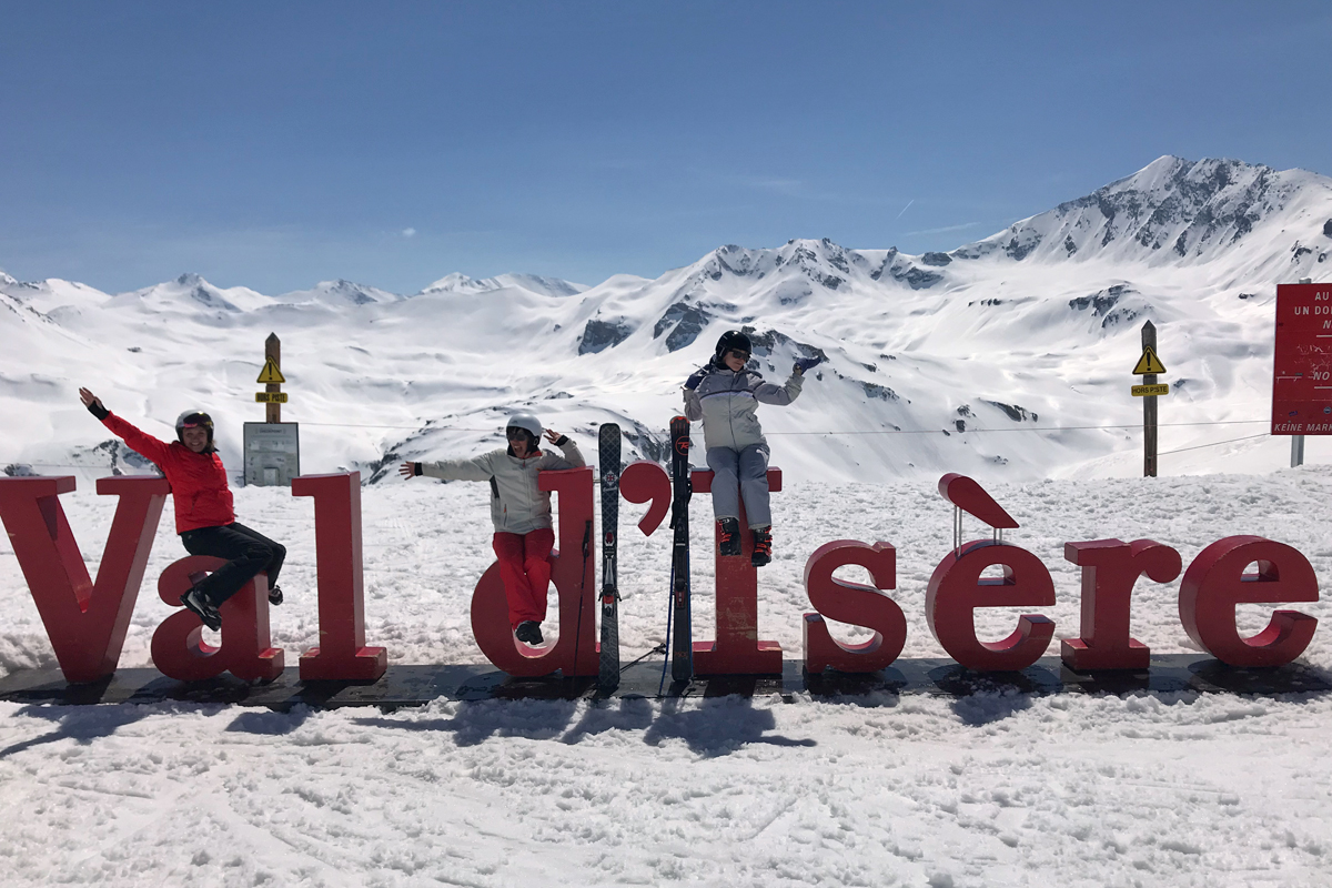 Posing on the Val d'Isere sign at the Grand Pré